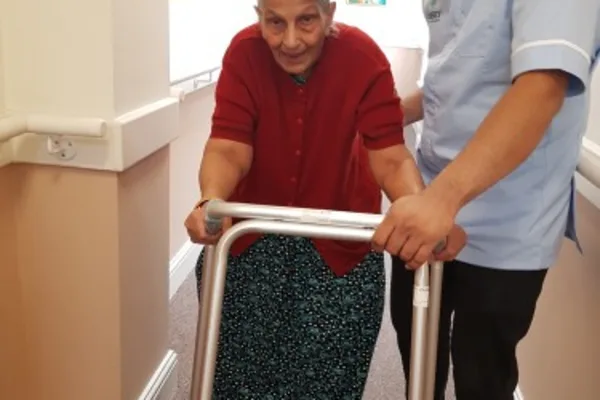 Staff member engaging in memory activities with a resident